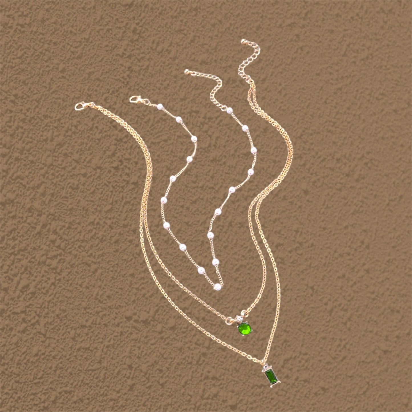 Gold Emerald Tri Layer Chain.